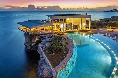 An all-inclusive beach resort with a pool